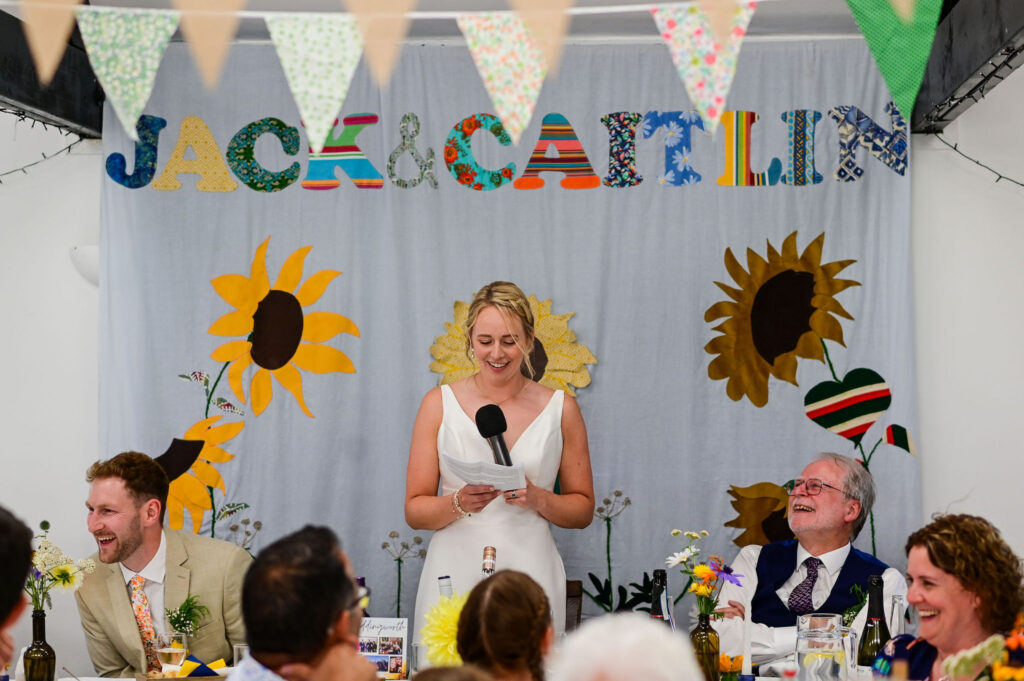 Bride starts speeches at Leicestershire wedding in Market Harborough